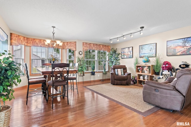 2308 Halifax Ave, Chatham, IL 62629 - living room with a chandelier and wood finished floors