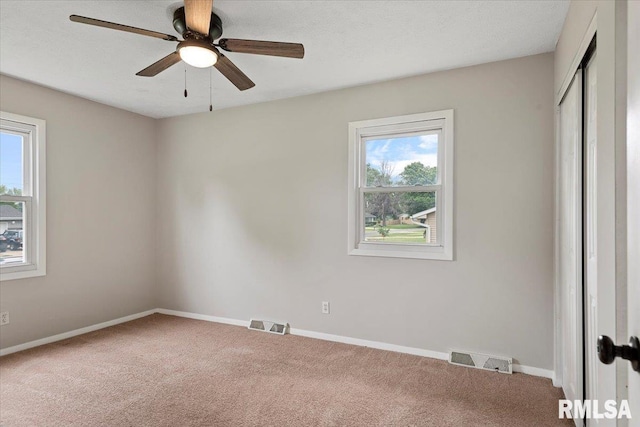 27 Twilight Ln, Springfield, IL 62712 - unfurnished bedroom with carpet, multiple windows, a closet, and a ceiling fan