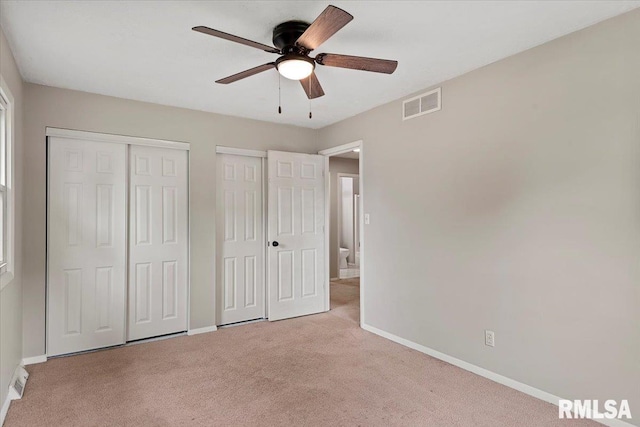 27 Twilight Ln, Springfield, IL 62712 - unfurnished bedroom with two closets, carpet, and a ceiling fan