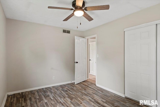 27 Twilight Ln, Springfield, IL 62712 - unfurnished bedroom with wood finished floors, a closet, and ceiling fan
