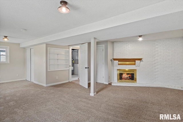 27 Twilight Ln, Springfield, IL 62712 - below grade area featuring carpet, a fireplace, a textured ceiling, and brick wall