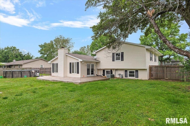 27 Twilight Ln, Springfield, IL 62712 - back of house with a fenced backyard, a chimney, a patio area, and a pool