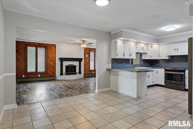 27 Twilight Ln, Springfield, IL 62712 - kitchen featuring electric range, open floor plan, a peninsula, white cabinetry, and a ceiling fan