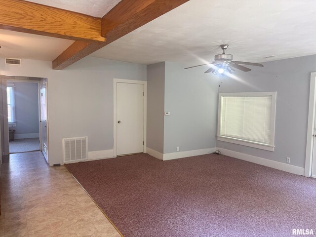 220 E Adams St, Petersburg, IL 62675 - empty room with a ceiling fan and beam ceiling