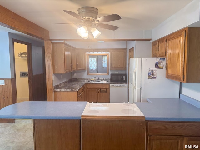 220 E Adams St, Petersburg, IL 62675 - kitchen with white appliances, a ceiling fan, a peninsula, and brown cabinetry