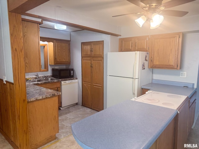 220 E Adams St, Petersburg, IL 62675 - kitchen with white appliances, a ceiling fan, dark countertops, and a peninsula
