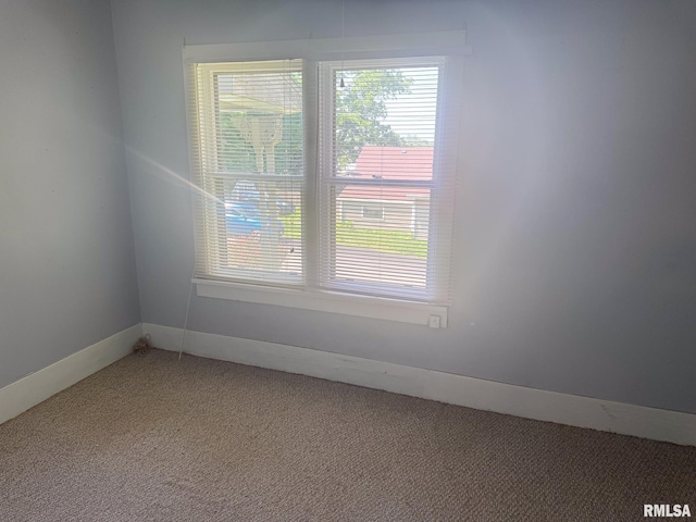 220 E Adams St, Petersburg, IL 62675 - empty room with light carpet and baseboards