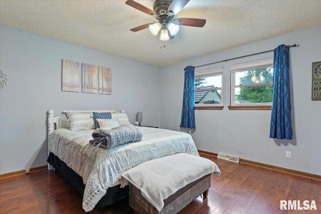 838 Hackberry Rd, Chatham, IL 62629 - bedroom featuring wood finished floors, a textured ceiling, and a ceiling fan