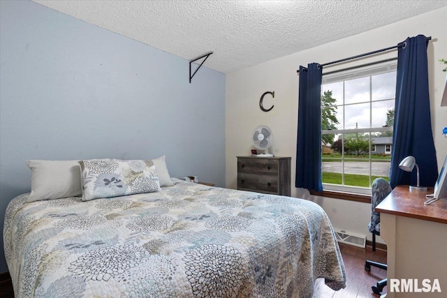 838 Hackberry Rd, Chatham, IL 62629 - bedroom featuring wood finished floors and a textured ceiling