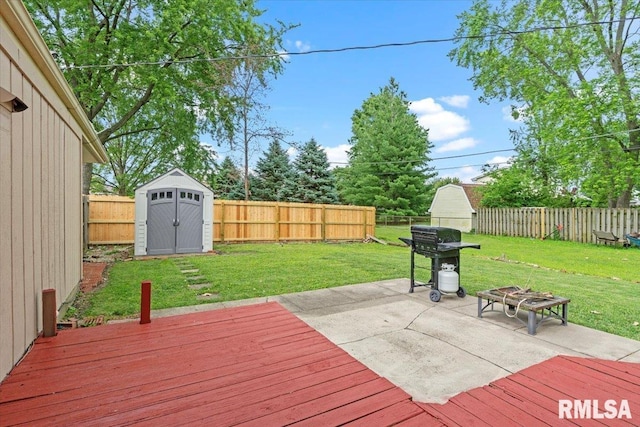 838 Hackberry Rd, Chatham, IL 62629 - deck with a fenced backyard, a storage unit, an outdoor fire pit, and a patio area