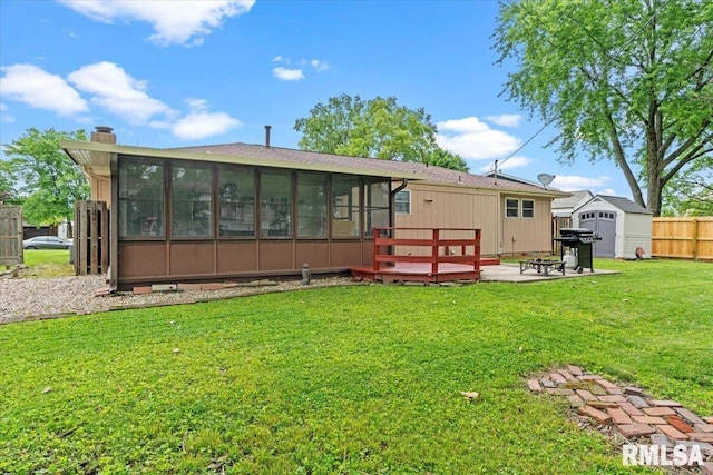 838 Hackberry Rd, Chatham, IL 62629 - rear view of property featuring a sunroom, a wooden deck, a storage unit, and a chimney