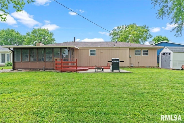 838 Hackberry Rd, Chatham, IL 62629 - back of property featuring a sunroom, a patio area, a shed, and a lawn