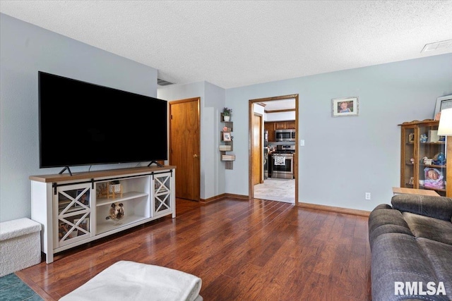 838 Hackberry Rd, Chatham, IL 62629 - living room with wood finished floors and a textured ceiling