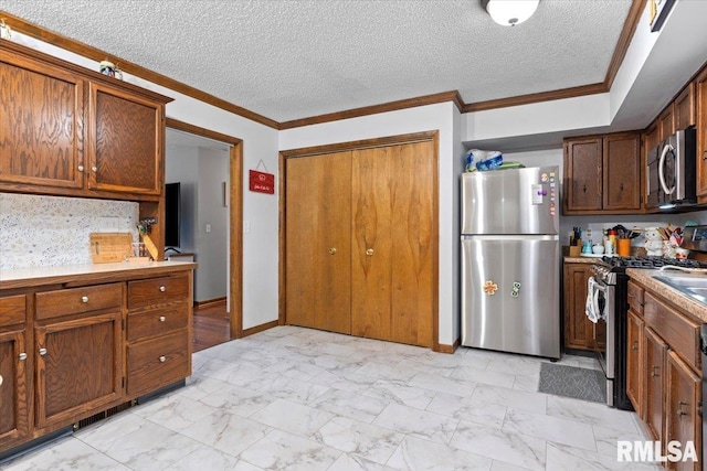 838 Hackberry Rd, Chatham, IL 62629 - kitchen featuring appliances with stainless steel finishes, light marble finish floors, crown molding, a textured ceiling, and light countertops