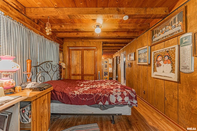 5190 Park Rd, Clinton, IL 61727 - bedroom with a wooden ceiling with exposed beams, wood finished floors, and wooden walls