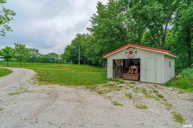5190 Park Rd, Clinton, IL 61727 - view of grassy yard with an outdoor structure