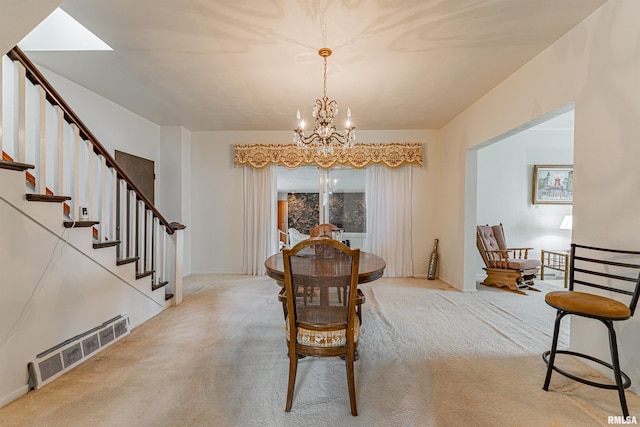 9320 Dawson Ln, Riverton, IL 62561 - carpeted dining room with a chandelier and stairs