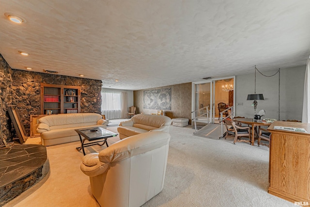 9320 Dawson Ln, Riverton, IL 62561 - carpeted living room featuring a textured ceiling and a chandelier