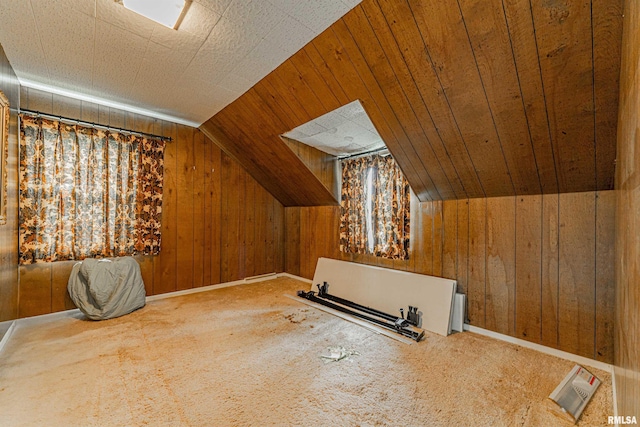 9320 Dawson Ln, Riverton, IL 62561 - additional living space featuring wood walls, vaulted ceiling, and carpet flooring
