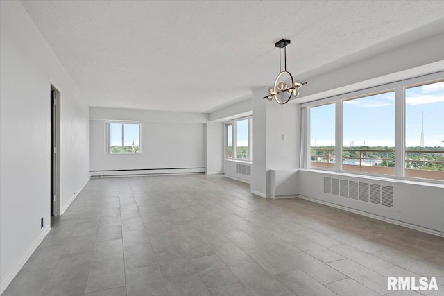 718 S 7th St Unit 1000, Springfield, IL 62703 - empty room with a textured ceiling, healthy amount of natural light, a chandelier, baseboard heating, and radiator