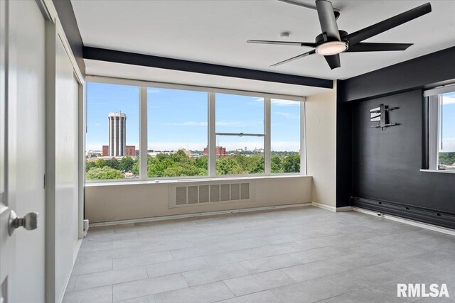 718 S 7th St Unit 1000, Springfield, IL 62703 - spare room with healthy amount of natural light, ceiling fan, and a view of city
