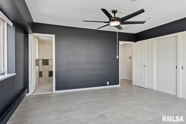 718 S 7th St Unit 1000, Springfield, IL 62703 - unfurnished bedroom with light tile patterned floors, ensuite bathroom, and a ceiling fan