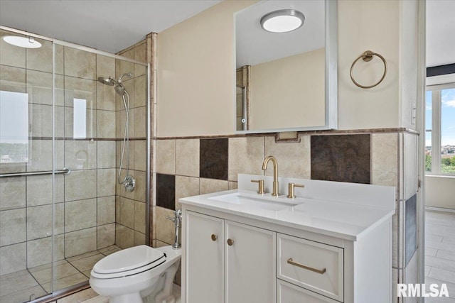718 S 7th St Unit 1000, Springfield, IL 62703 - bathroom featuring a stall shower, vanity, tile walls, and tile patterned floors