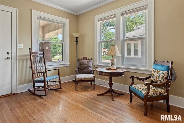 2141 S 4th St, Springfield, IL 62703 - living area featuring light wood-style floors and crown molding