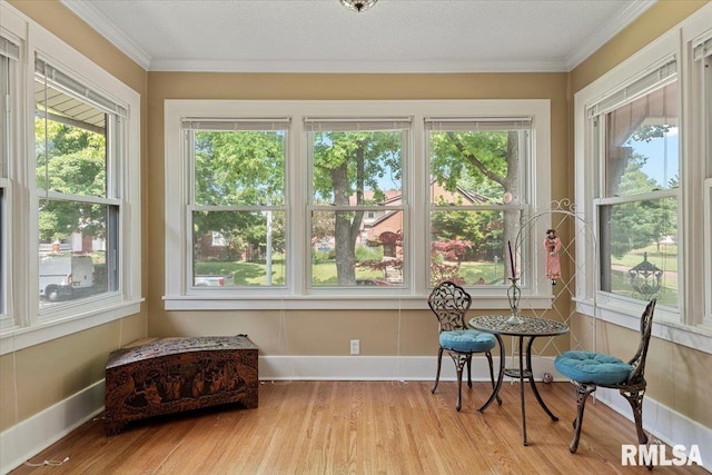 2141 S 4th St, Springfield, IL 62703 - sunroom featuring wood finished floors, crown molding, and healthy amount of natural light
