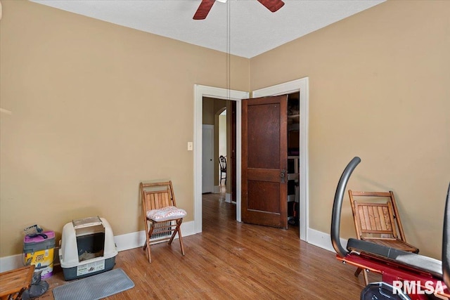 2141 S 4th St, Springfield, IL 62703 - living area with wood finished floors, arched walkways, and a ceiling fan