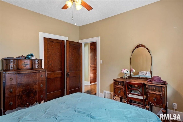 2141 S 4th St, Springfield, IL 62703 - bedroom with baseboards and ceiling fan