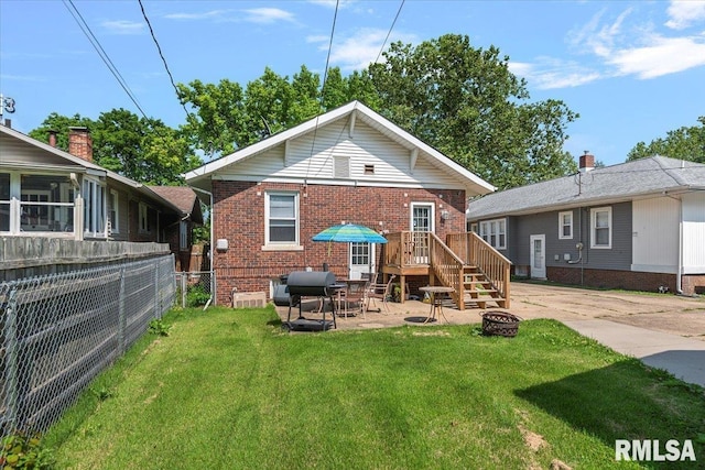 2141 S 4th St, Springfield, IL 62703 - rear view of property featuring brick siding, a fire pit, and a patio area