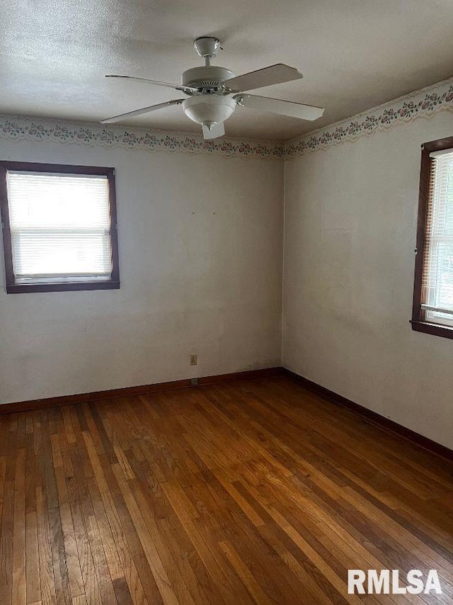 604 Eastman Ave Unit A, Springfield, IL 62702 - spare room featuring dark wood finished floors, plenty of natural light, and ceiling fan