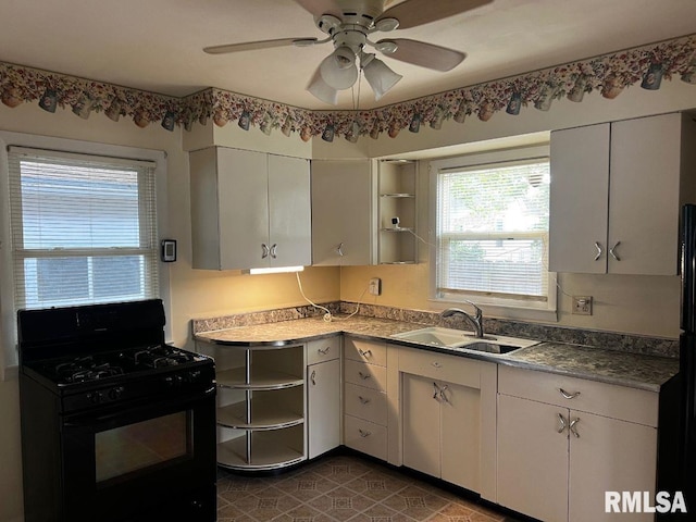 604 Eastman Ave Unit A, Springfield, IL 62702 - kitchen with black range with gas cooktop, open shelves, ceiling fan, and white cabinets