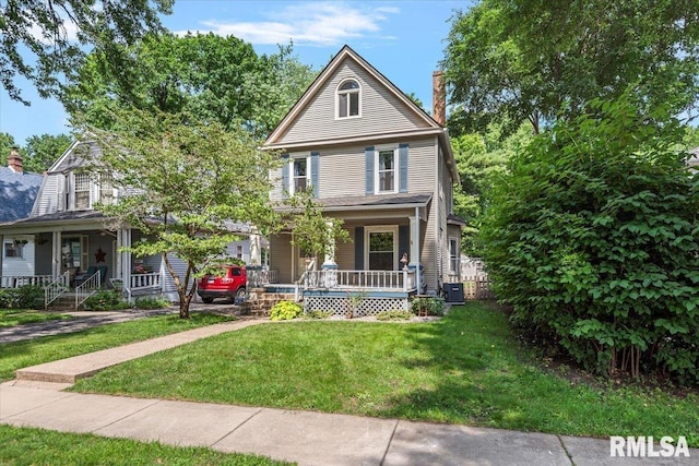 720 S Park Ave, Springfield, IL 62704 - view of front of property featuring covered porch, a chimney, and a front lawn