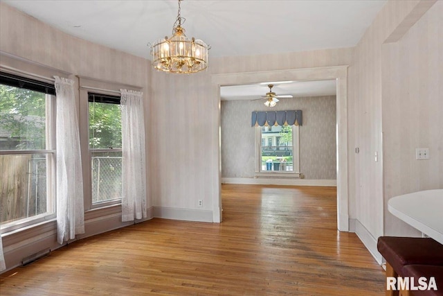 720 S Park Ave, Springfield, IL 62704 - unfurnished dining area featuring wood finished floors, a chandelier, and ceiling fan