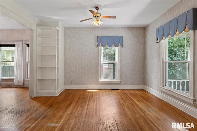 720 S Park Ave, Springfield, IL 62704 - empty room featuring hardwood / wood-style floors, healthy amount of natural light, ceiling fan, and wallpapered walls