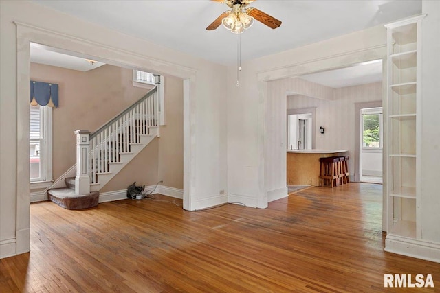 720 S Park Ave, Springfield, IL 62704 - unfurnished living room with hardwood / wood-style floors, a ceiling fan, and stairs