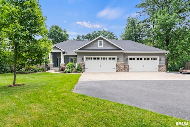 10 The Elms Ln, Springfield, IL 62712 - craftsman-style house with driveway, stone siding, an attached garage, and a front yard