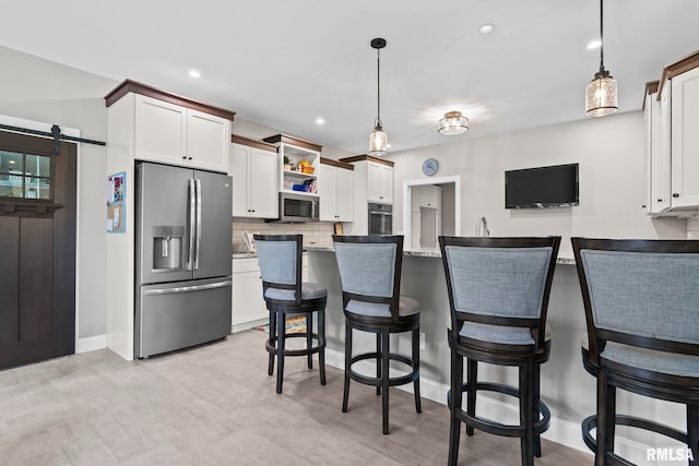 10 The Elms Ln, Springfield, IL 62712 - kitchen featuring appliances with stainless steel finishes, decorative backsplash, decorative light fixtures, open shelves, and recessed lighting