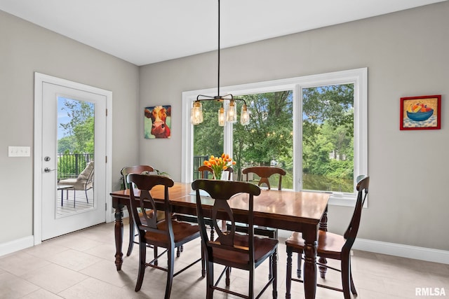 10 The Elms Ln, Springfield, IL 62712 - dining room featuring healthy amount of natural light, a chandelier, and light tile patterned floors