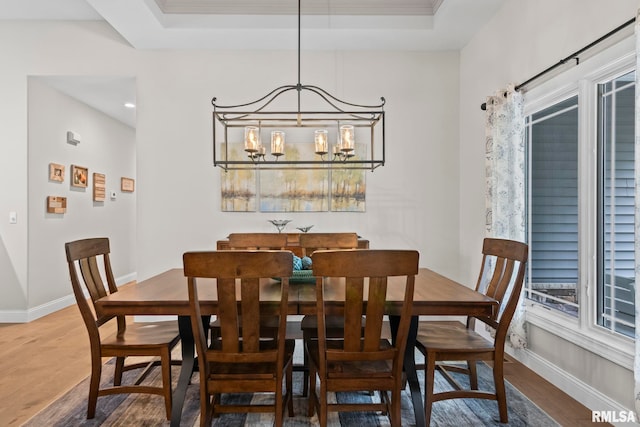 10 The Elms Ln, Springfield, IL 62712 - dining area featuring wood finished floors, a chandelier, and a raised ceiling