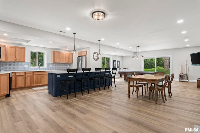10 The Elms Ln, Springfield, IL 62712 - kitchen featuring freestanding refrigerator, recessed lighting, light wood-type flooring, and a center island