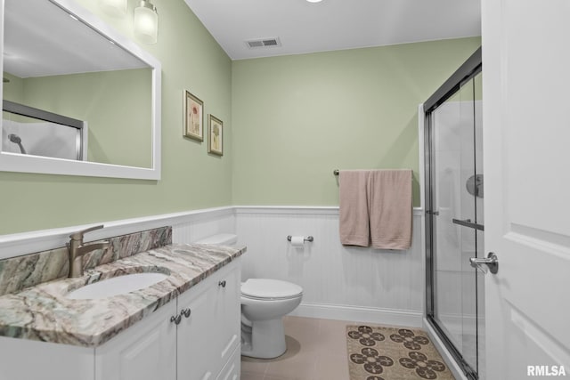 10 The Elms Ln, Springfield, IL 62712 - full bathroom featuring vanity, wainscoting, a stall shower, and tile patterned flooring