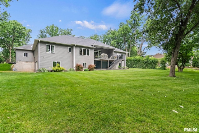 10 The Elms Ln, Springfield, IL 62712 - rear view of house featuring stairs, a deck, a yard, and a sunroom