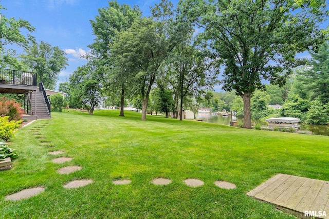10 The Elms Ln, Springfield, IL 62712 - view of green lawn featuring stairs and a deck with water view