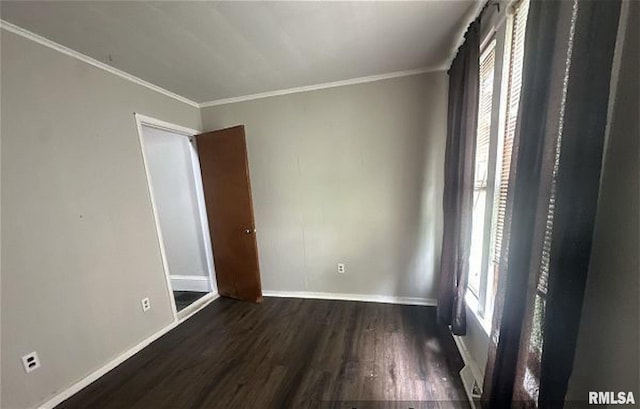 518 E 4th Ave, Monmouth, IL 61462 - spare room with wood finished floors and ornamental molding