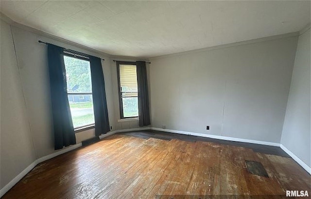 518 E 4th Ave, Monmouth, IL 61462 - spare room featuring hardwood / wood-style flooring