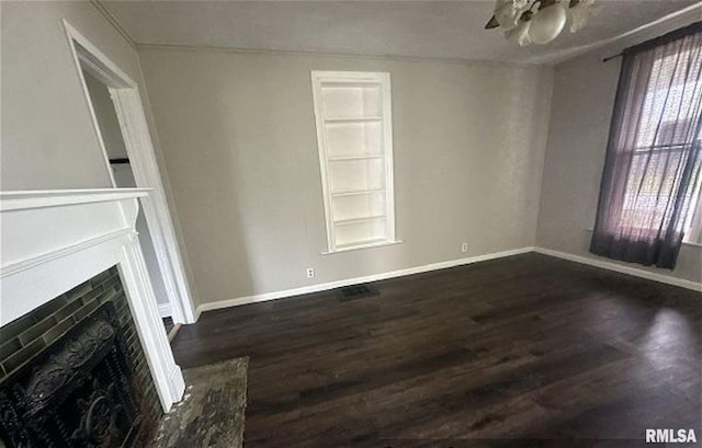 518 E 4th Ave, Monmouth, IL 61462 - unfurnished living room with wood finished floors, a fireplace, and ceiling fan