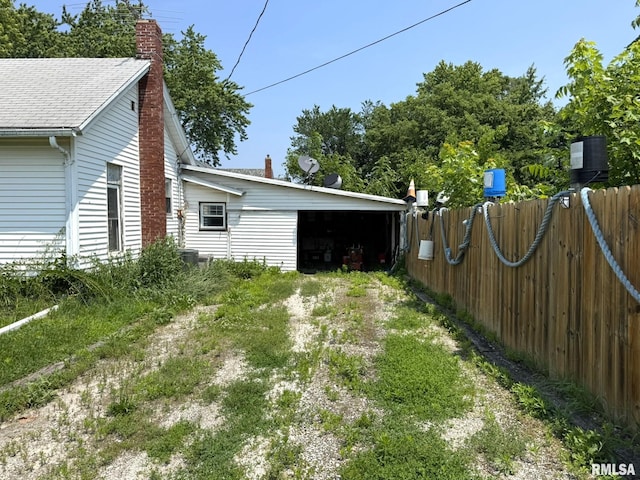 931 S A St, Monmouth, IL 61462 - view of yard featuring a carport and driveway
